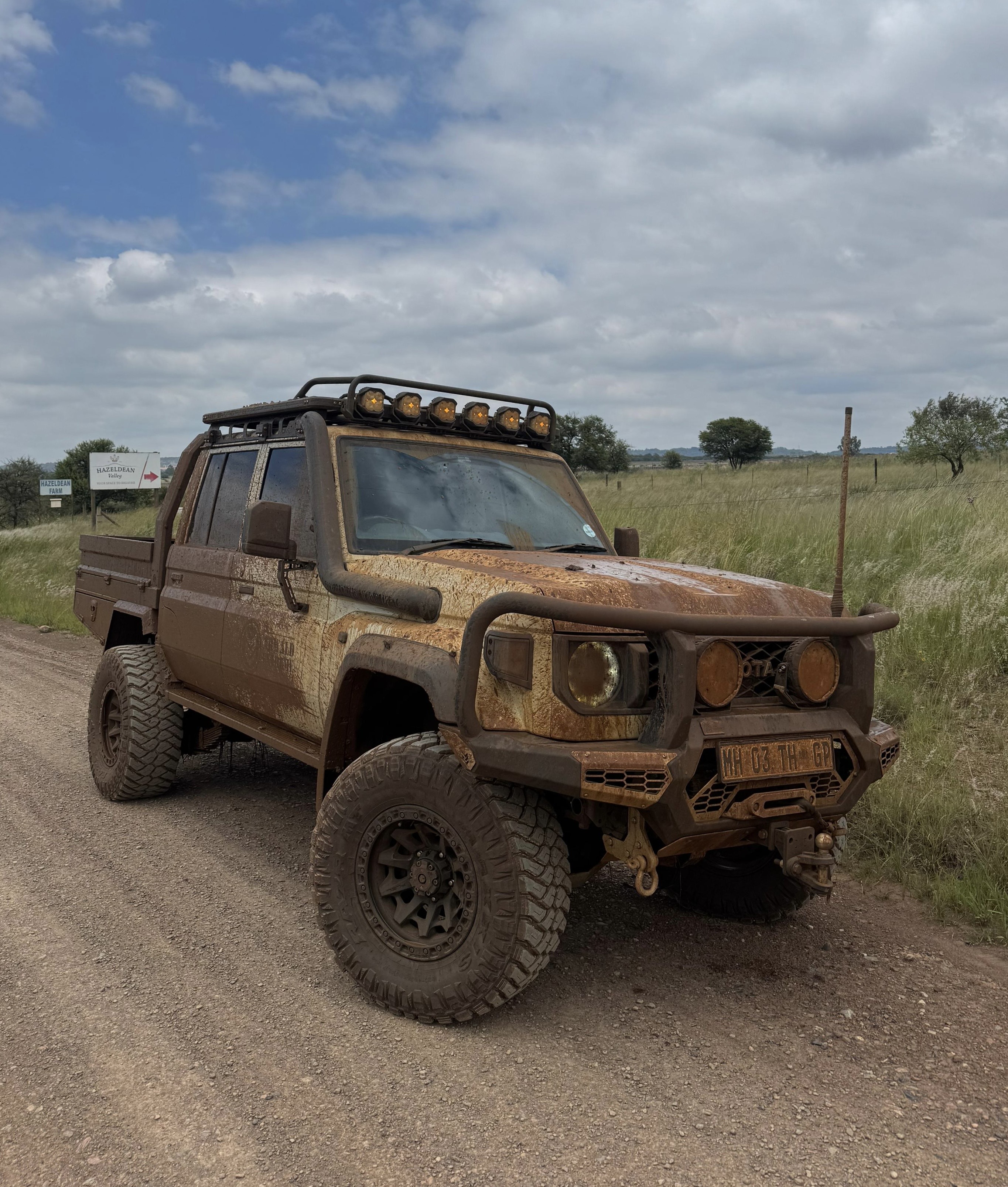 Toyota Land Cruiser Prado 250 in the field after a muddy run