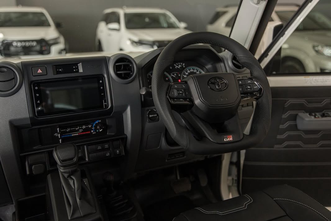 Land Cruiser cockpit with trimmed dash and infotainment fitment