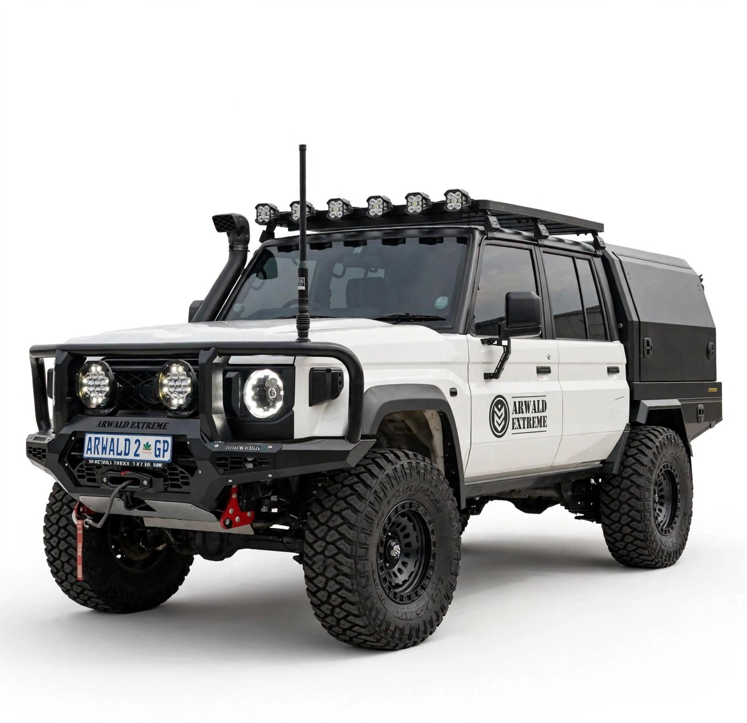White Land Cruiser 79 double-cab with canopy and roof rack, front three-quarter